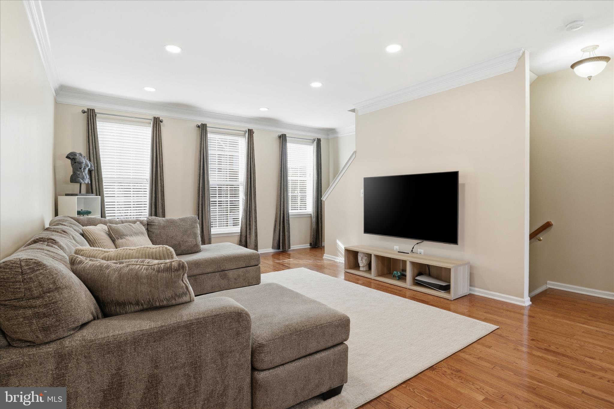 25114 Monteith Terrace Chantilly, VA 20152 - Photo 6 of 46 a living room with furniture and a flat screen tv