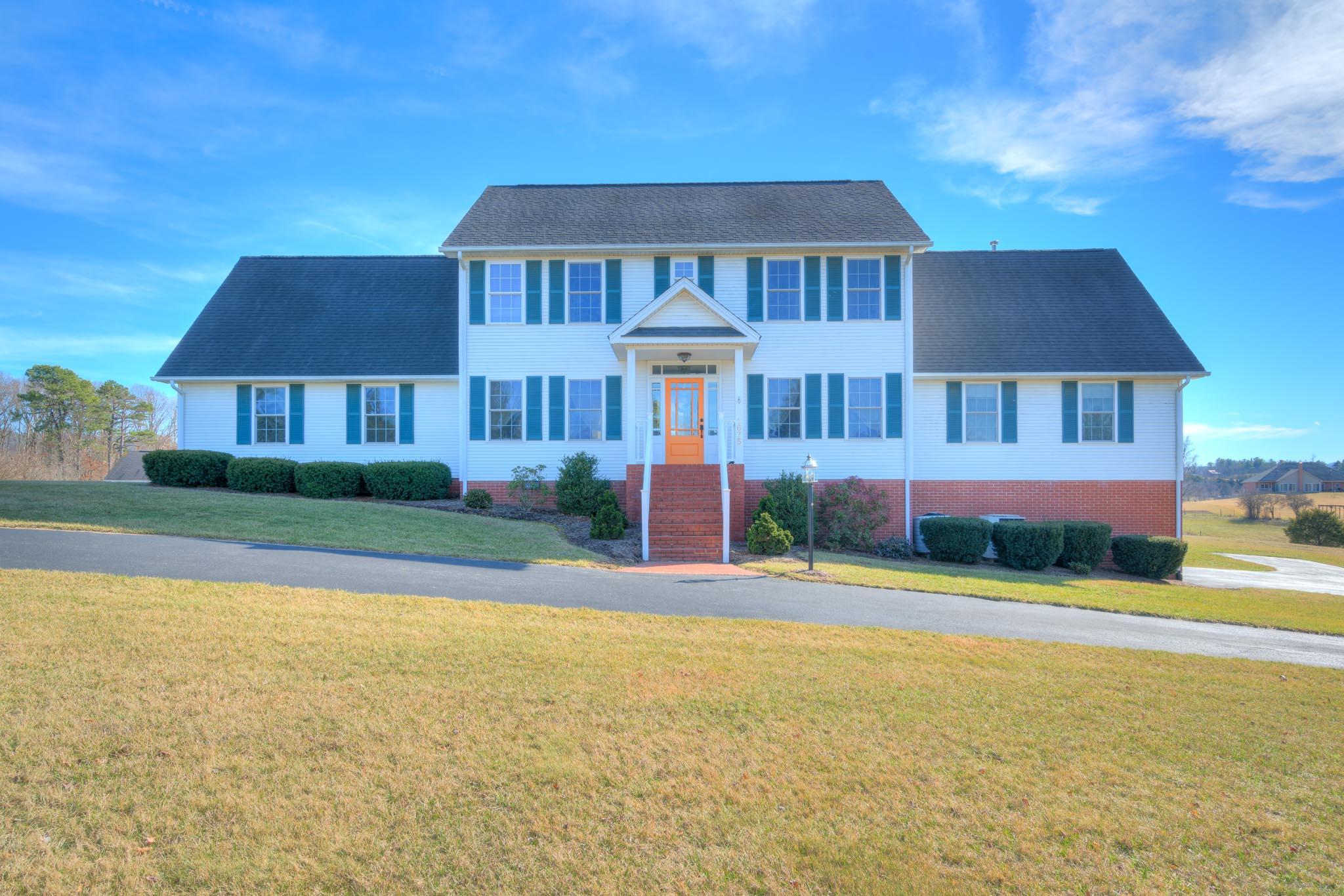 1675 Union Valley Road Riner, VA 24149 - Photo 1 of 50 a front view of a house with a yard and garage
