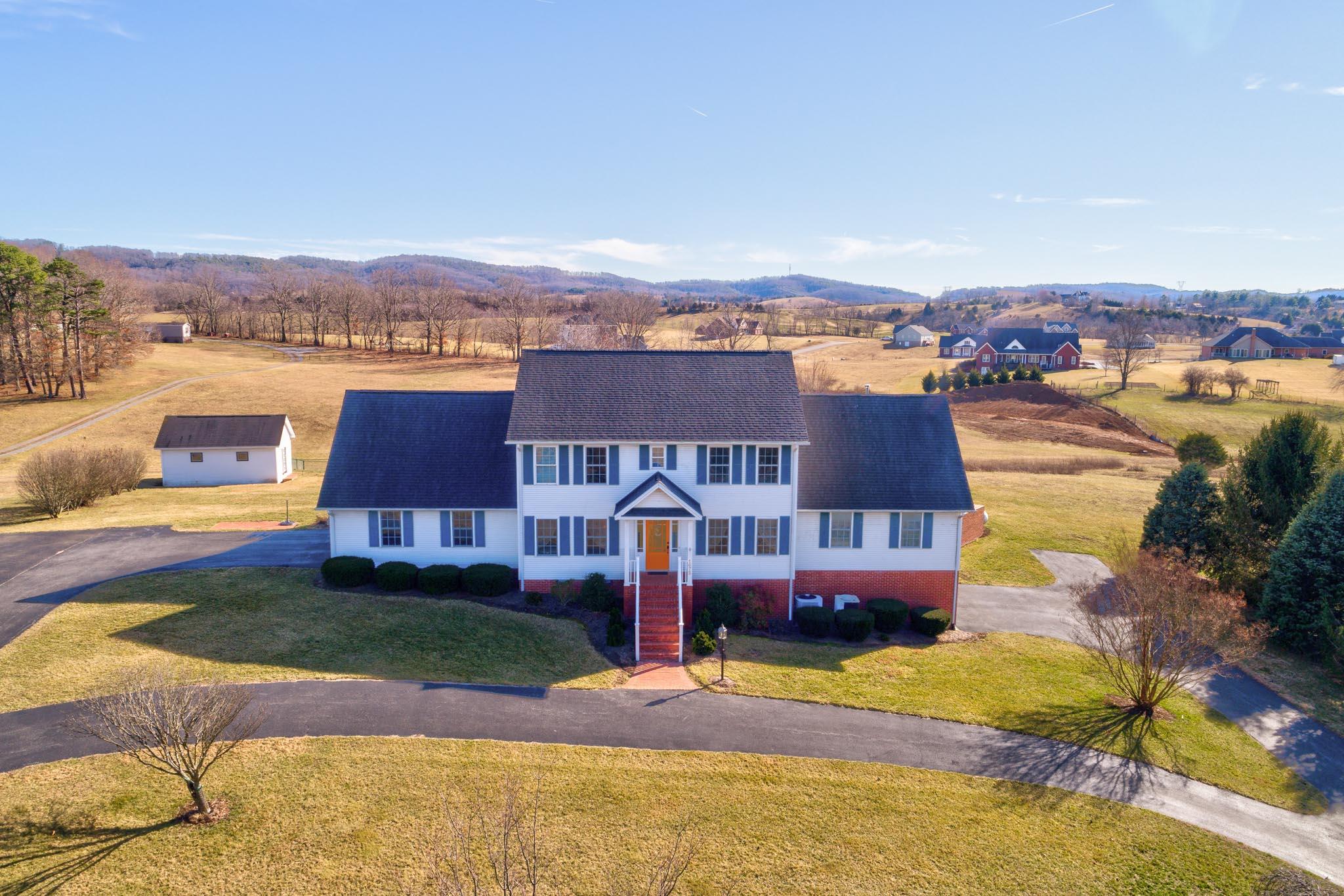 1675 Union Valley Road Riner, VA 24149 - Photo 2 of 50 an aerial view of a house with a yard basket ball court and outdoor seating