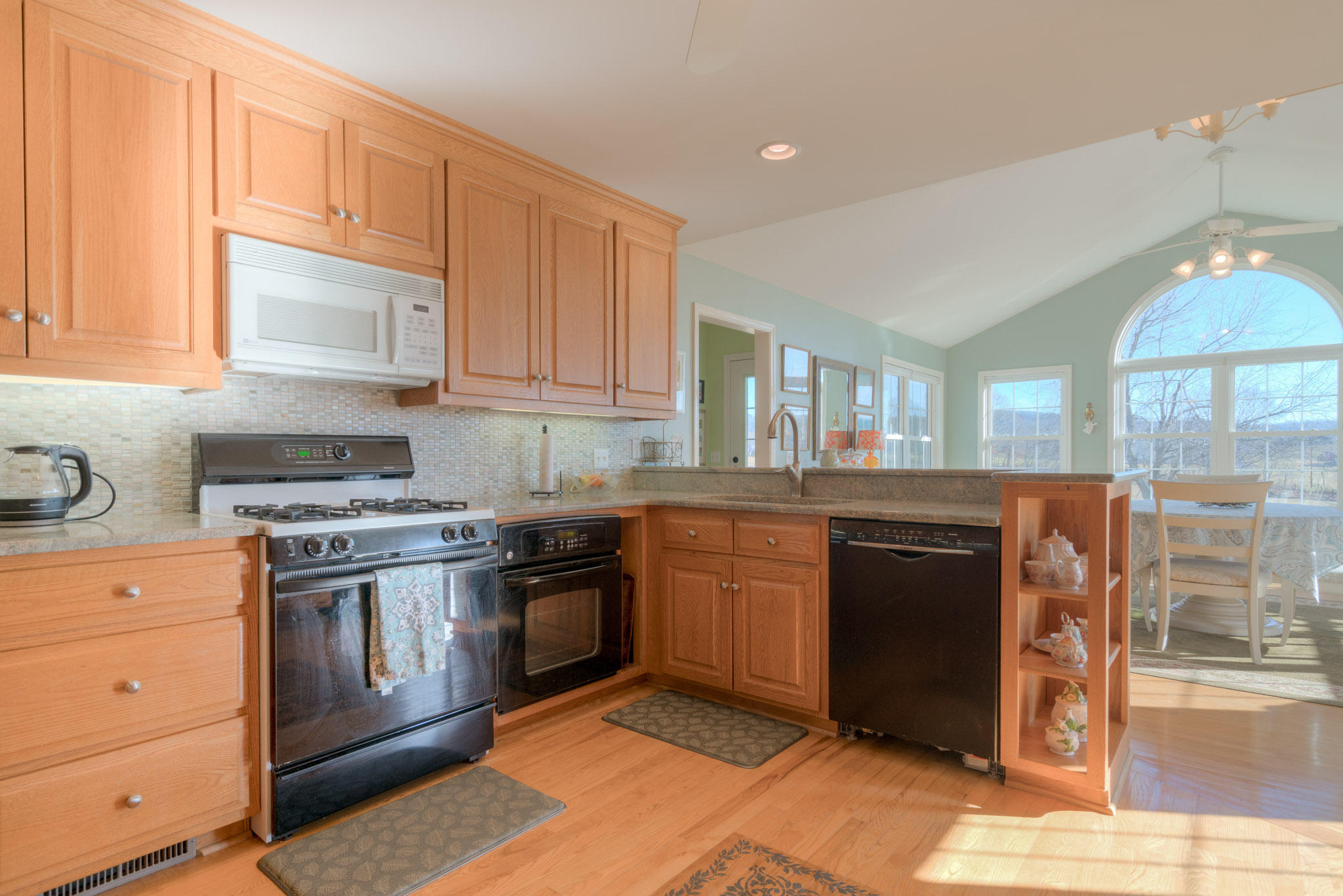 1675 Union Valley Road Riner, VA 24149 - Photo 15 of 50 a kitchen with stainless steel appliances granite countertop a stove and a sink