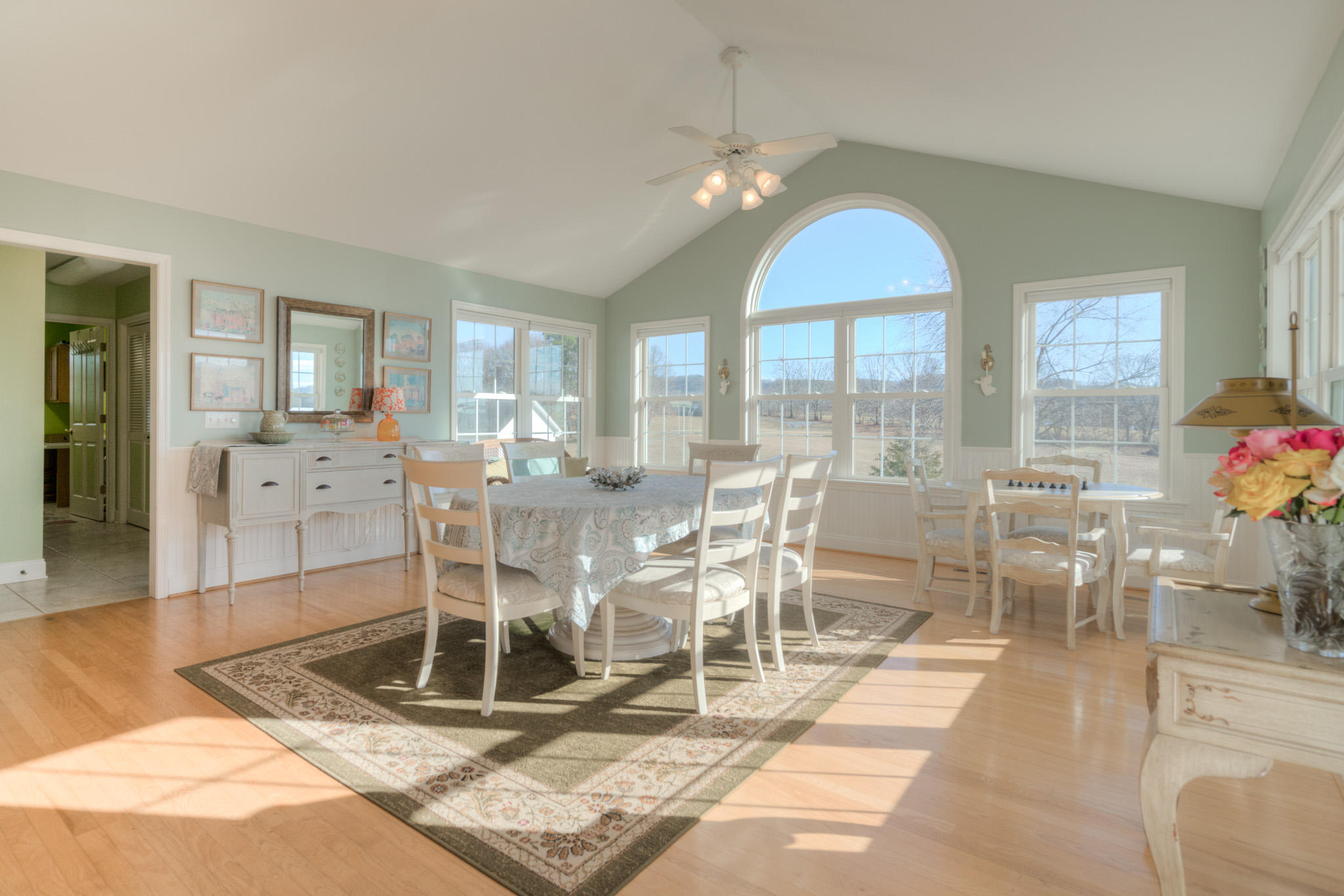 1675 Union Valley Road Riner, VA 24149 - Photo 19 of 50 a room with lots of white furniture and glass door