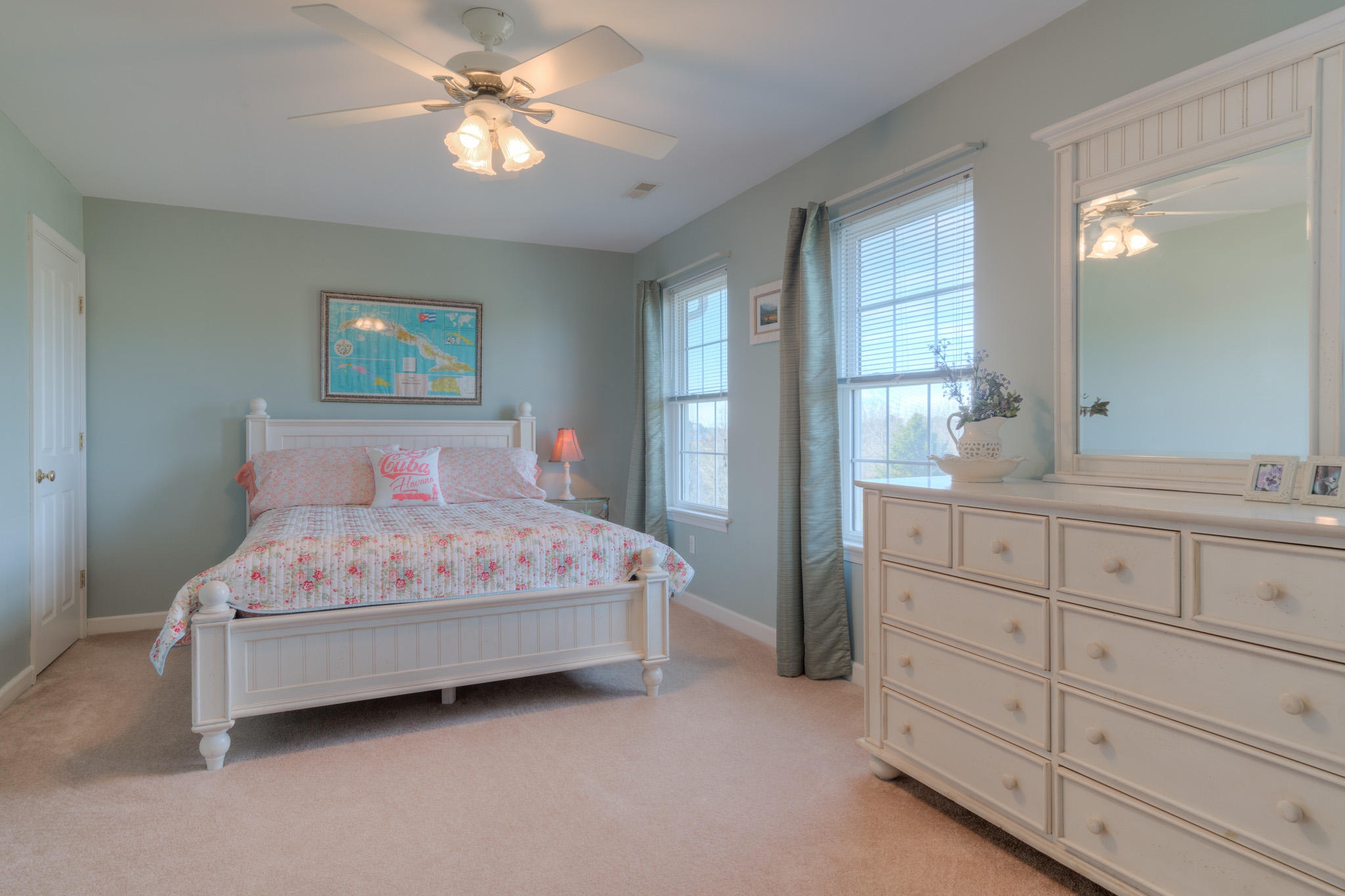 1675 Union Valley Road Riner, VA 24149 - Photo 28 of 50 a bedroom with a bed and a chandelier
