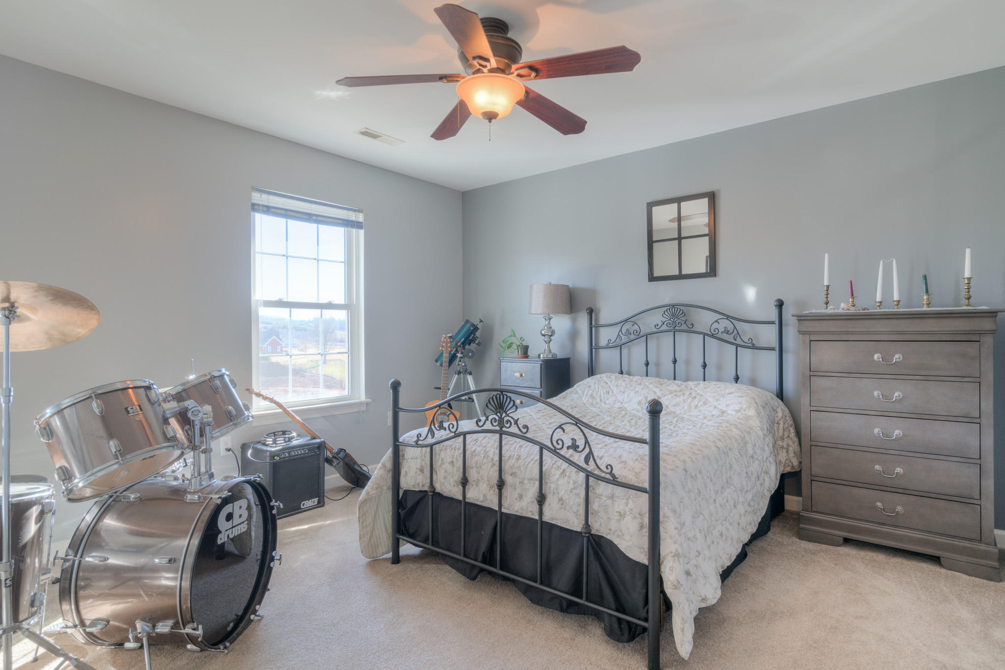 1675 Union Valley Road Riner, VA 24149 - Photo 29 of 50 a bedroom with a bed and a chandelier