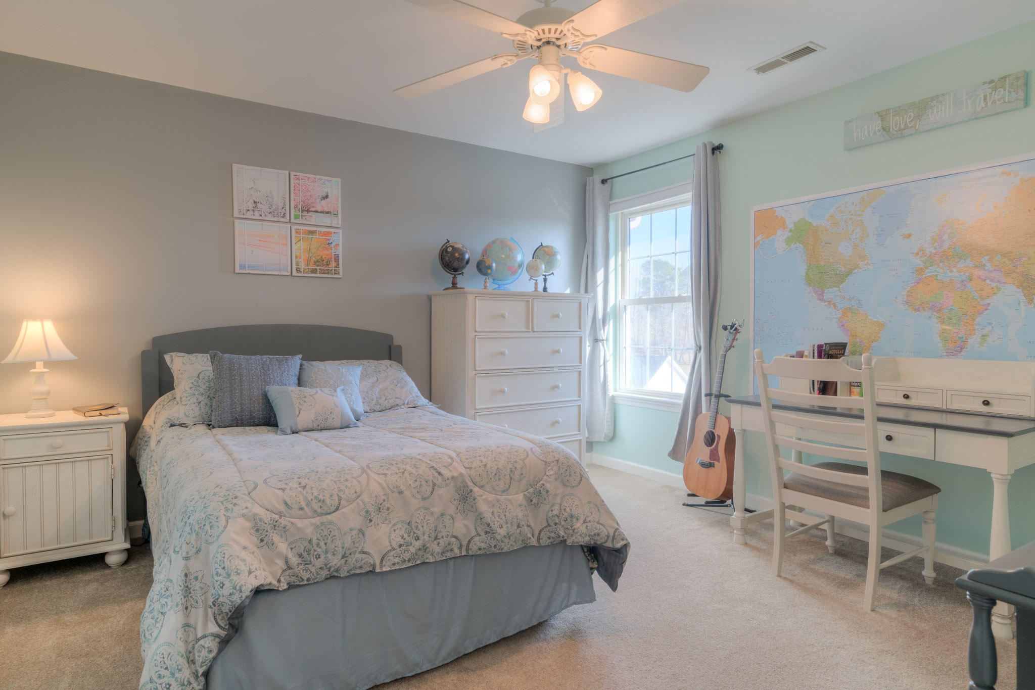 1675 Union Valley Road Riner, VA 24149 - Photo 30 of 50 a bedroom with a bed a chandelier and a window
