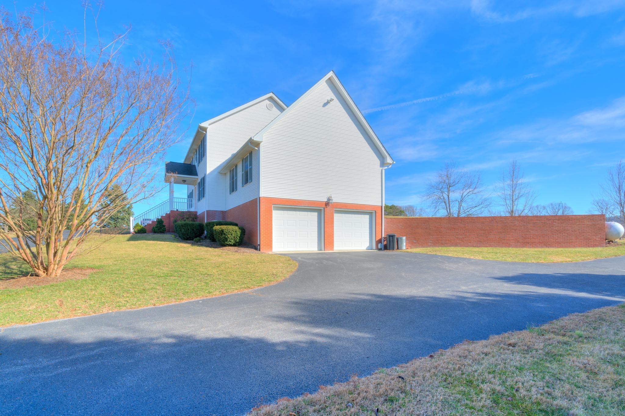 1675 Union Valley Road Riner, VA 24149 - Photo 40 of 50 a view of an house with backyard and tree