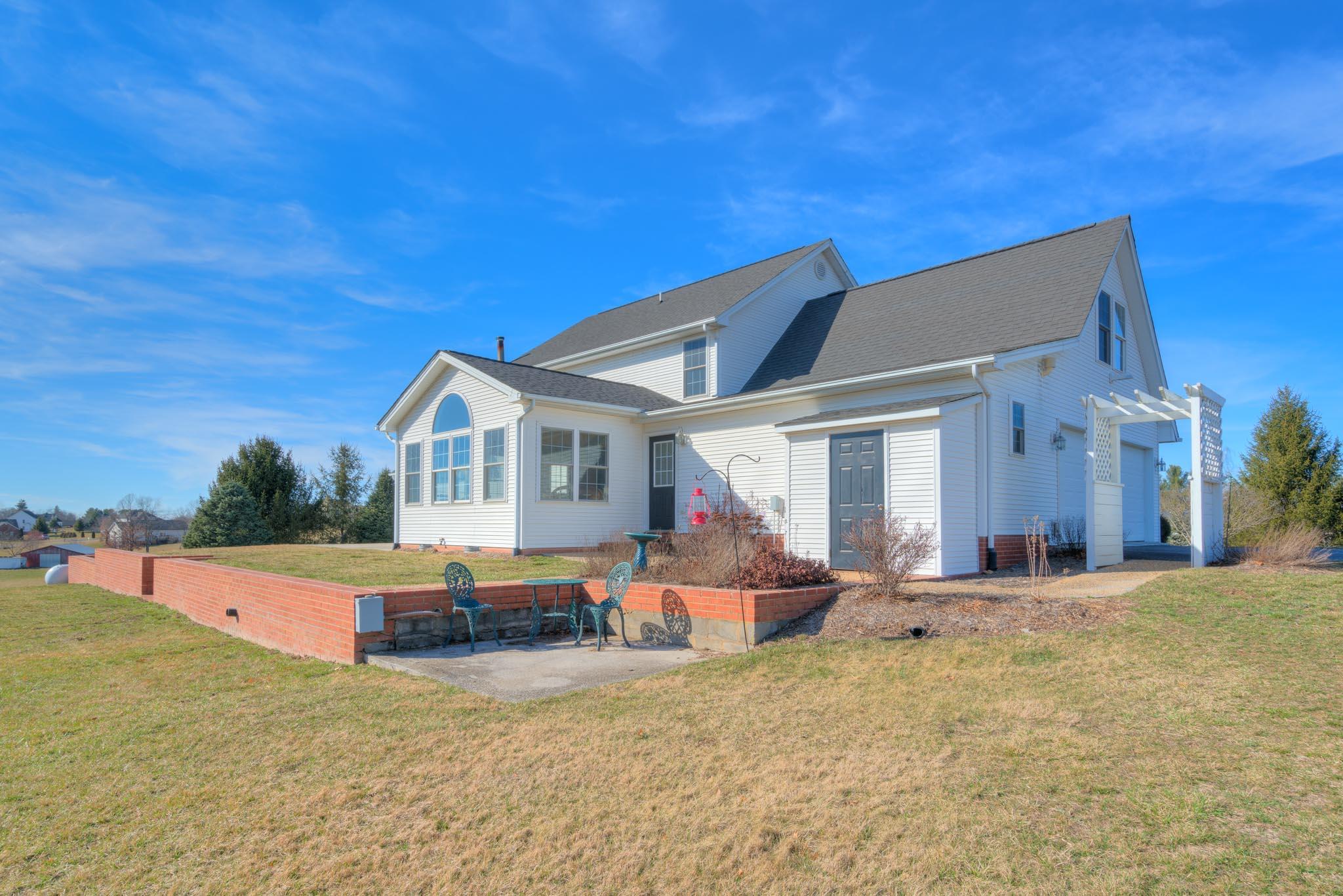 1675 Union Valley Road Riner, VA 24149 - Photo 44 of 50 a backyard of a house with table and chairs