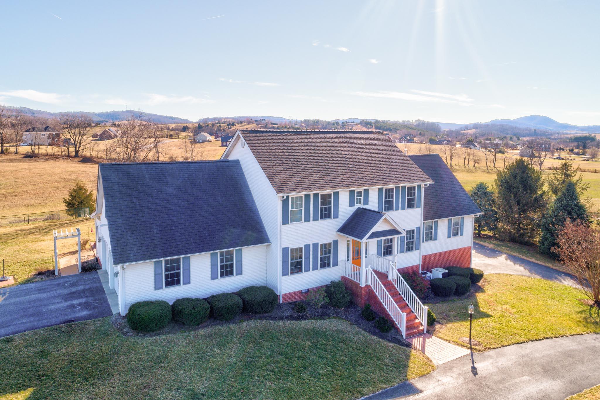 1675 Union Valley Road Riner, VA 24149 - Photo 46 of 50 an aerial view of multiple houses with a yard