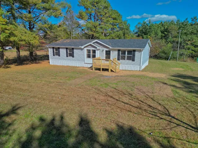 a front view of a house with yard