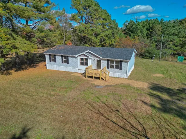 a house view with a garden space