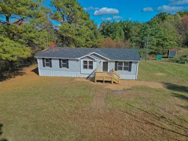 a house with a tree in front of it