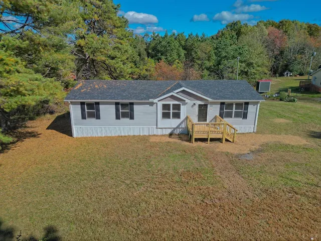 a house with trees in the background