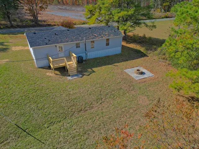 a aerial view of a house with a yard