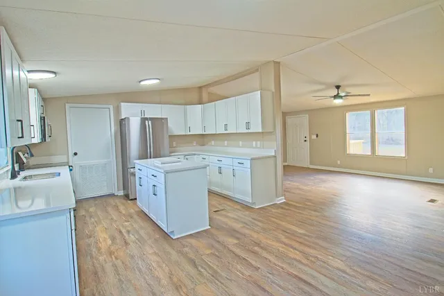 a kitchen with a cabinets and wooden floor