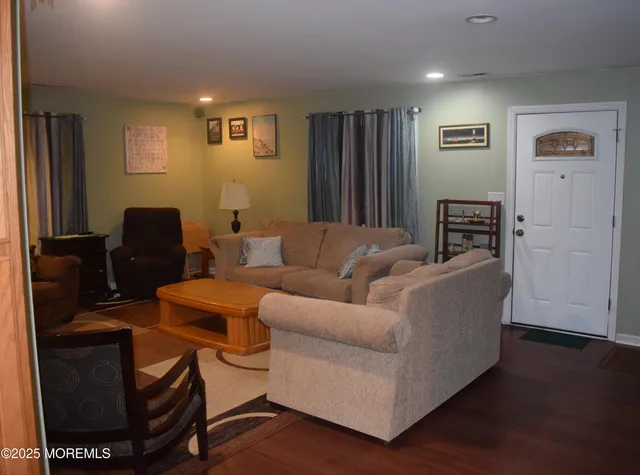 a bedroom with a bed and a mirror