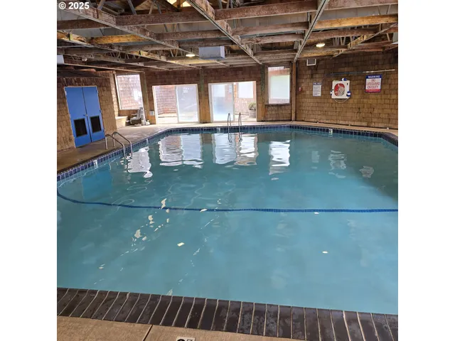 a view of a porch with a table and chairs