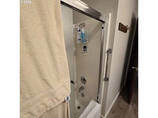 a bathroom with a shower and a tub