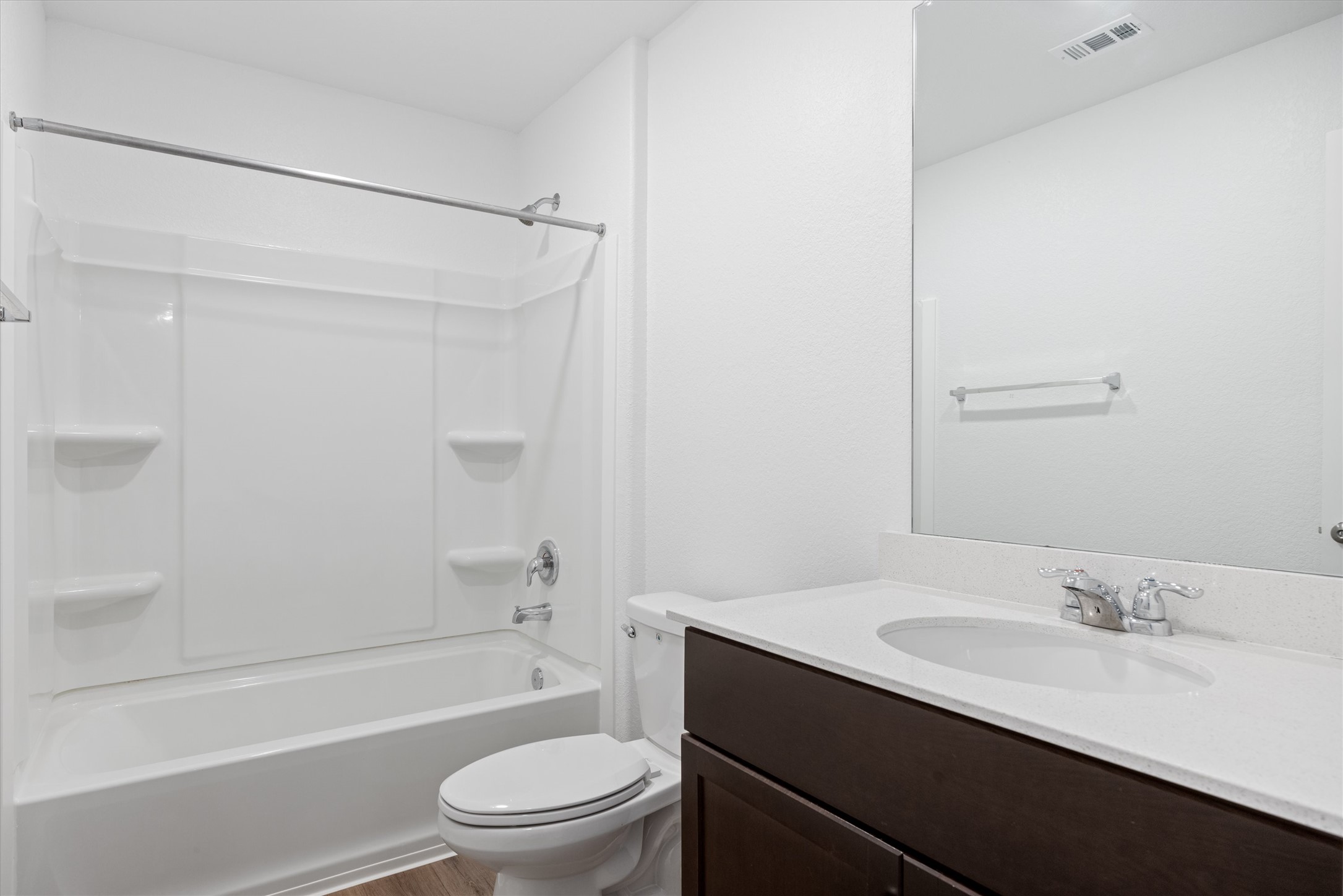 13520 Knights Branch Drive Elgin, TX 78621 - Photo 8 of 20 Full bathroom with vanity, shower / tub combination, and wood-style vinyl flooring