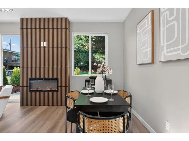 a dining room with furniture and window
