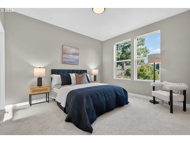 a bedroom with bed and large window