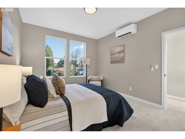 a bedroom with a bed and window