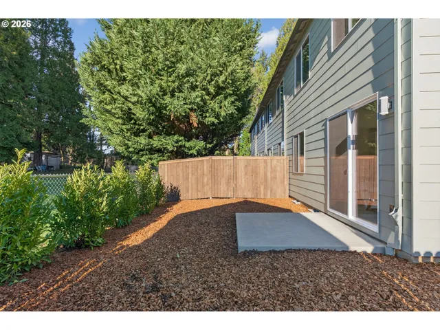 a backyard of a house with lots of green space