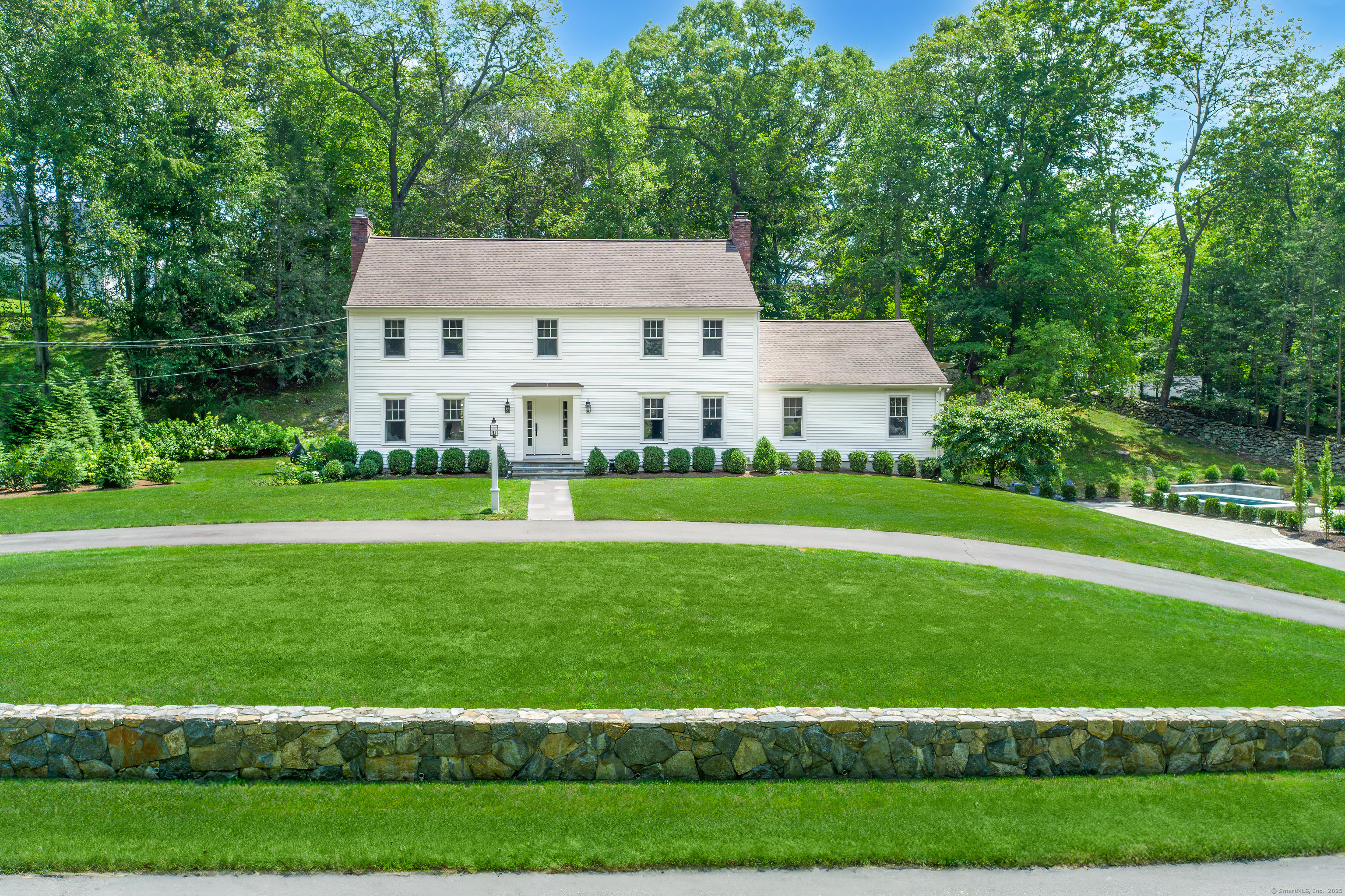 a view of house with a yard