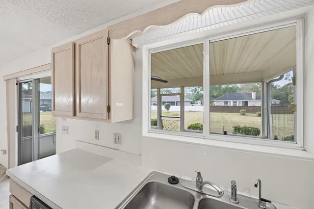 a bathroom with a sink a mirror and a shower