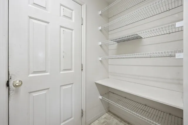 a view of a patio with a table and chairs