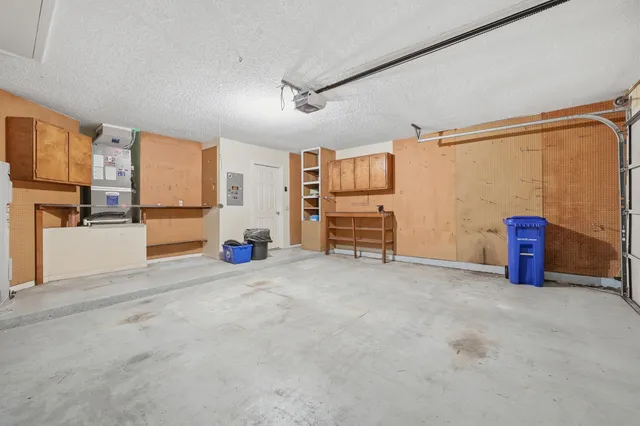 a view of a house with a garden and lake view