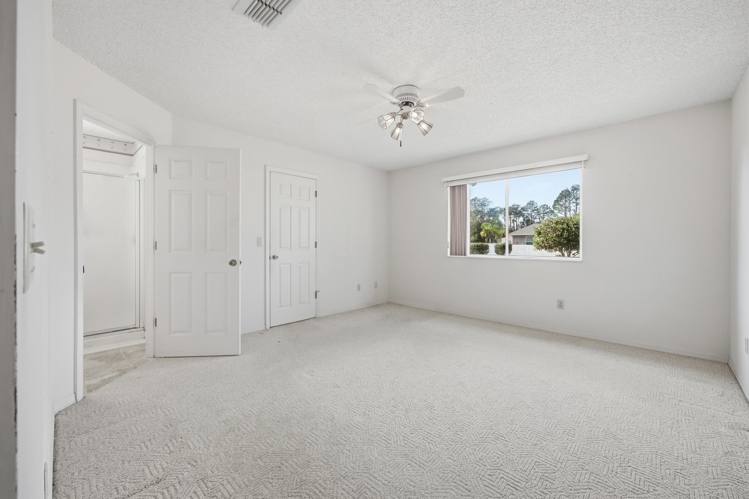 4628 Legends Lane Elkton, FL 32033 - Photo 18 of 49 a view of an empty room with a window