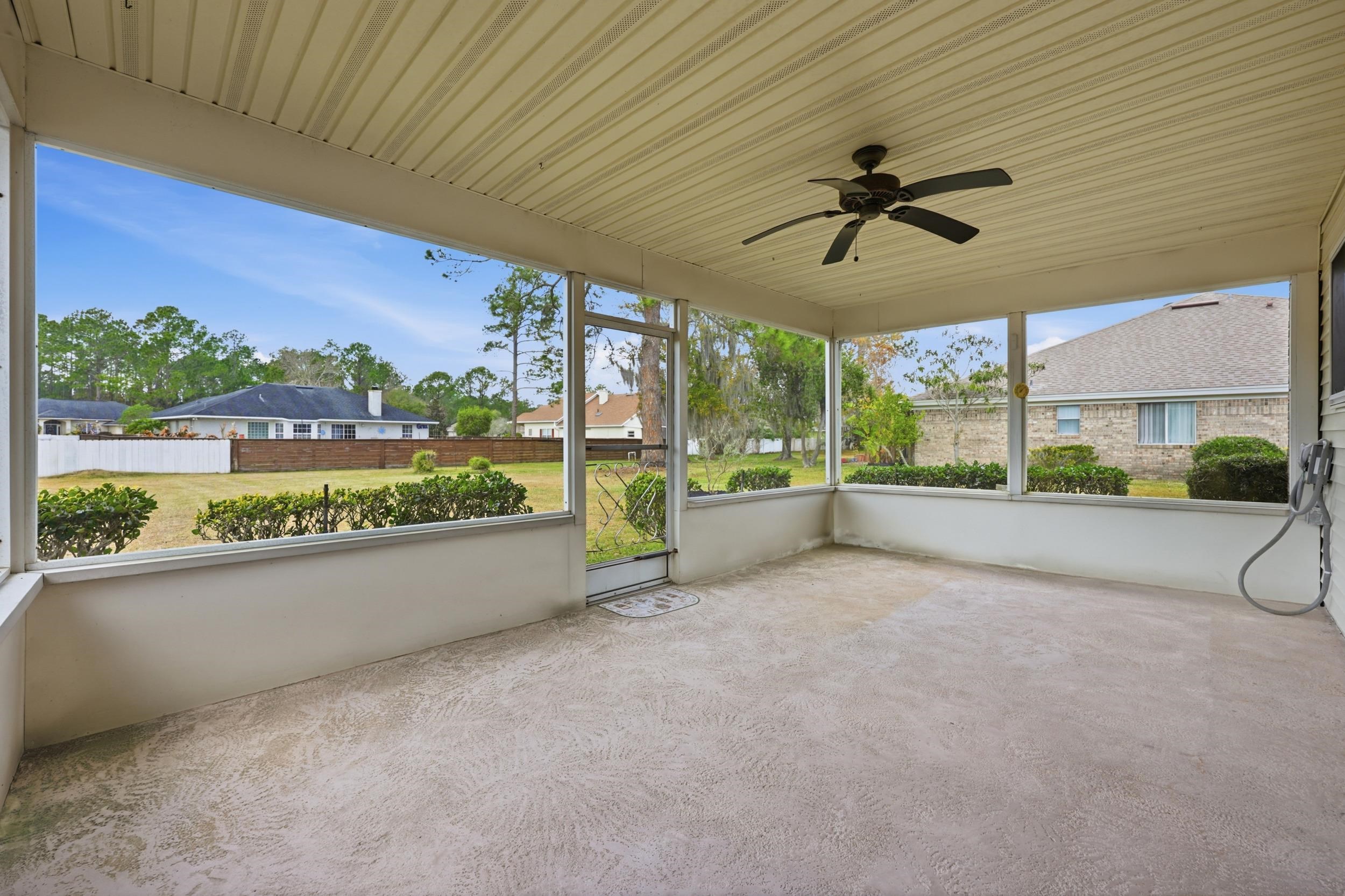 4628 Legends Lane Elkton, FL 32033 - Photo 26 of 49 a view of a patio with a table and chairs