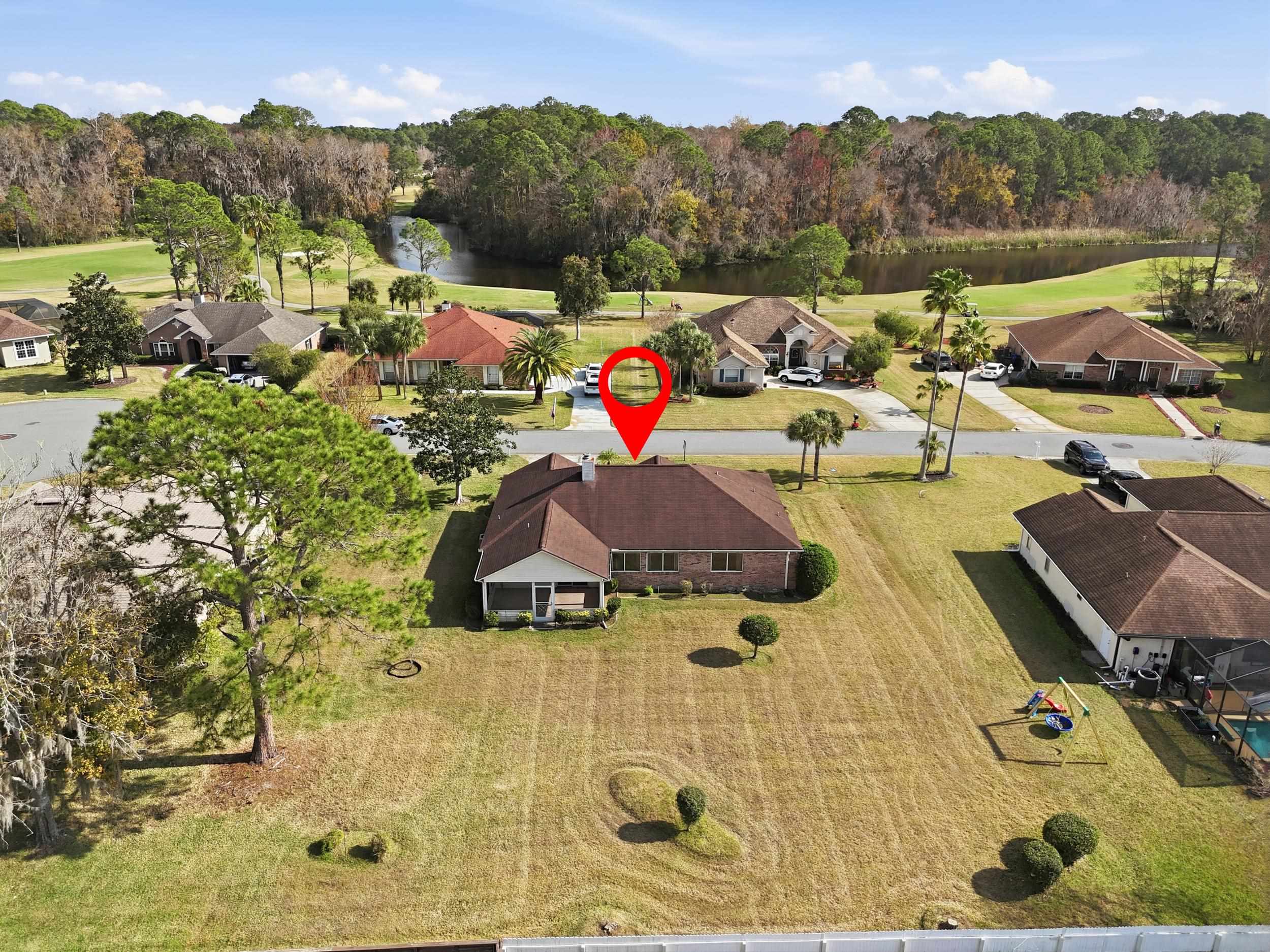 4628 Legends Lane Elkton, FL 32033 - Photo 34 of 49 Aerial perspective of suburban area featuring a nearby body of water