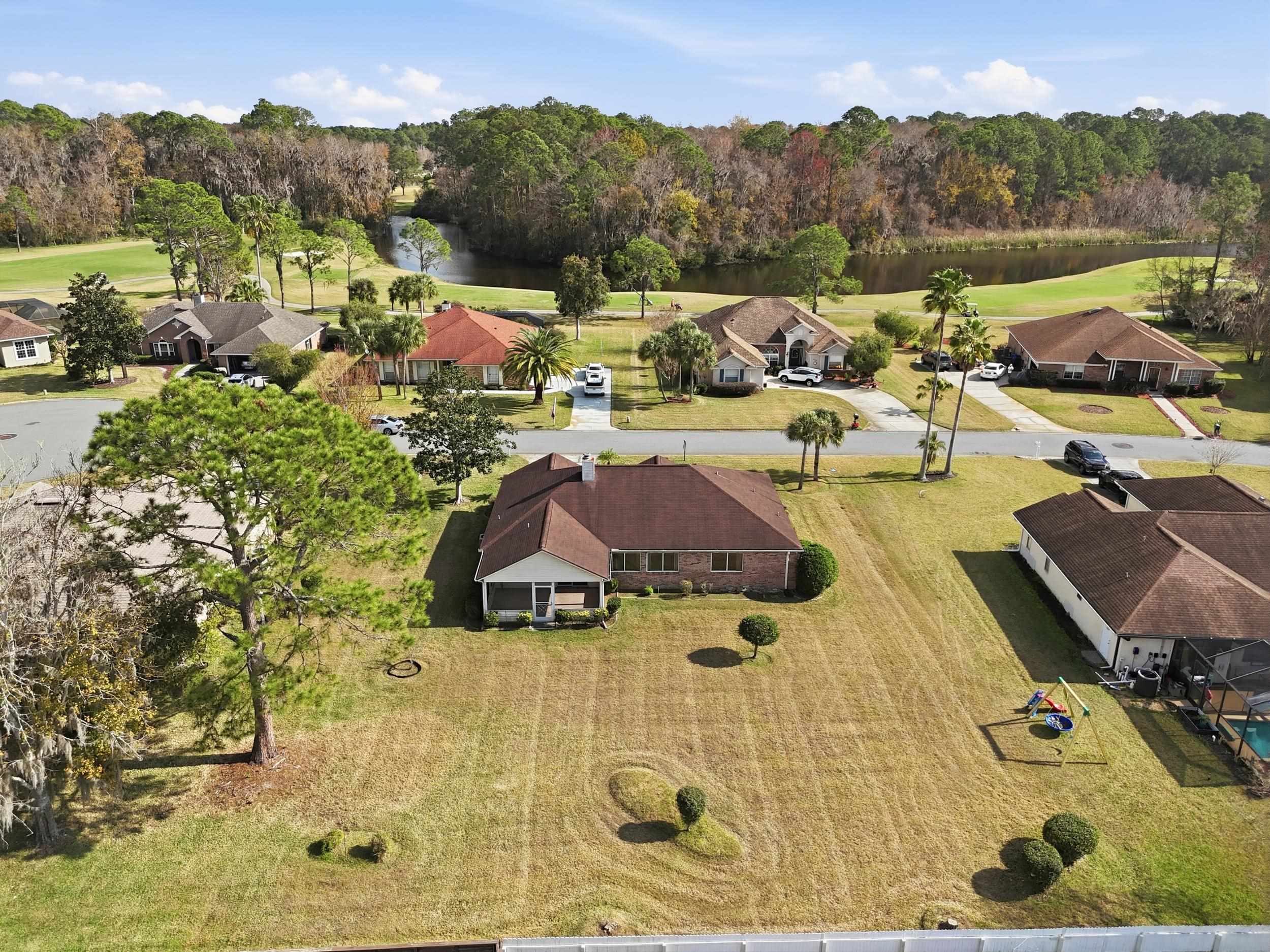 4628 Legends Lane Elkton, FL 32033 - Photo 35 of 49 Aerial perspective of suburban area with a large body of water