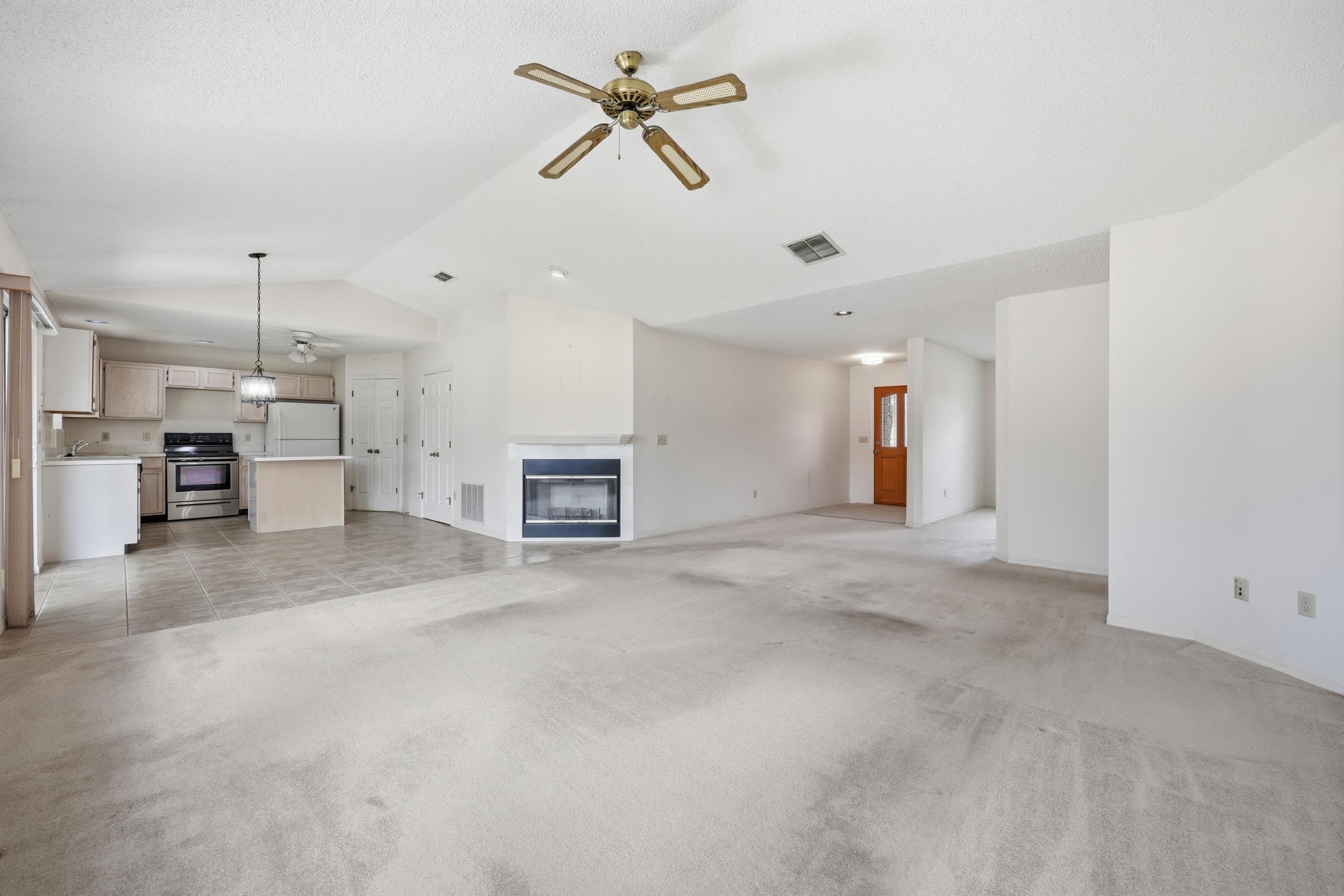 4628 Legends Lane Elkton, FL 32033 - Photo 7 of 49 a view of a kitchen with a sink and a ceiling fan
