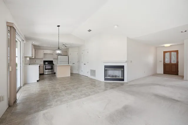 a kitchen with a sink appliances and cabinets