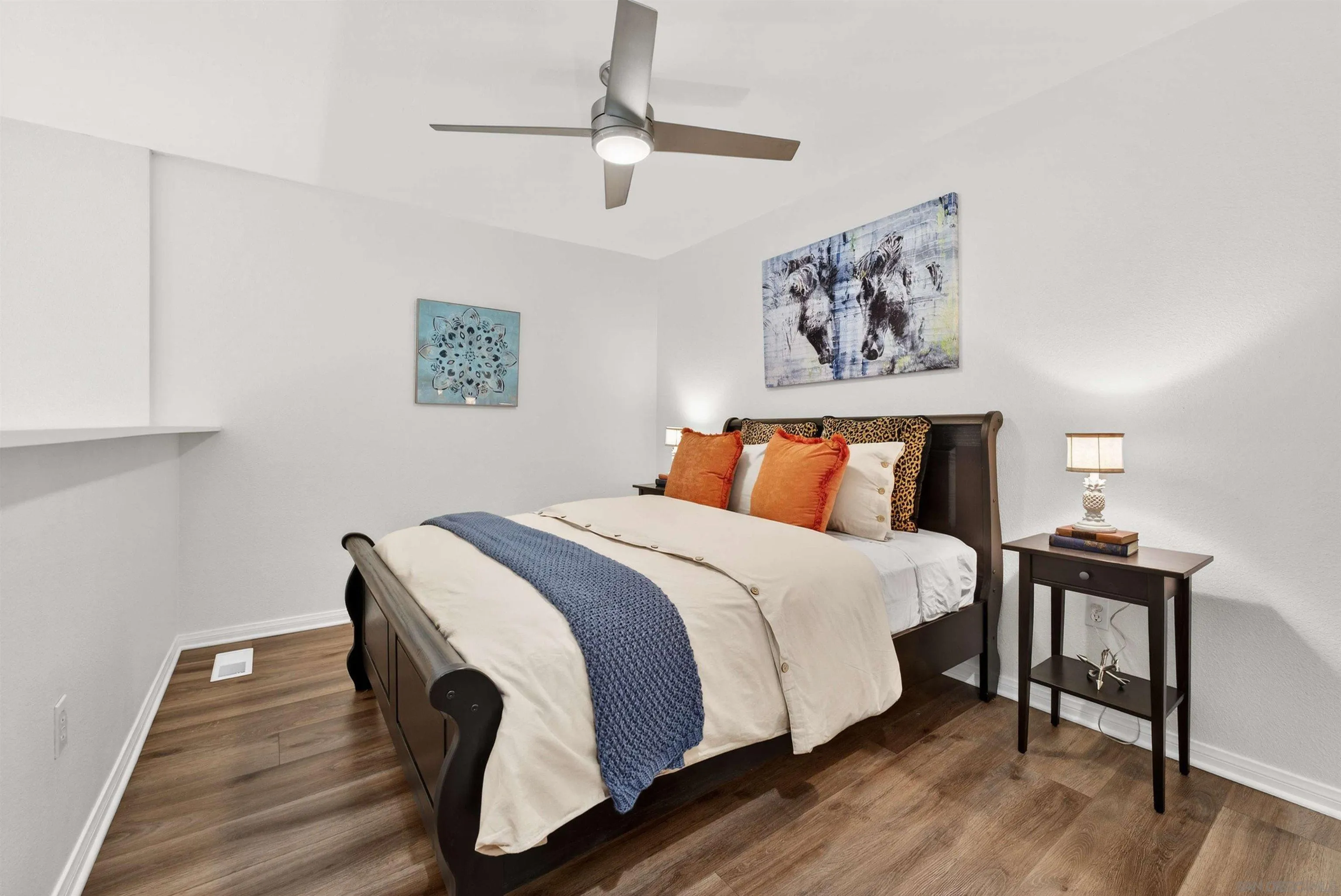 6255 Rancho Mission Road, Unit 302 San Diego, CA 92108 - Photo 16 of 28 a bedroom with bed and wooden floor