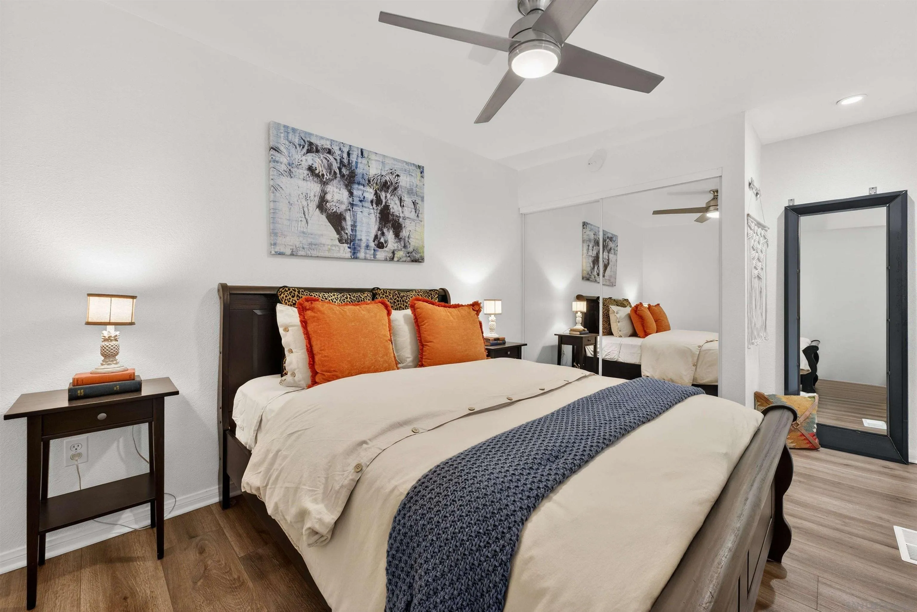 6255 Rancho Mission Road, Unit 302 San Diego, CA 92108 - Photo 17 of 28 a bed room with bed and a chandelier