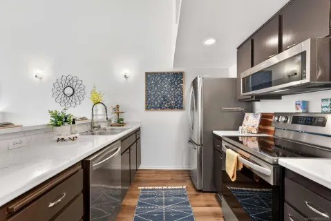 a spacious bathroom with a double vanity sink and a mirror