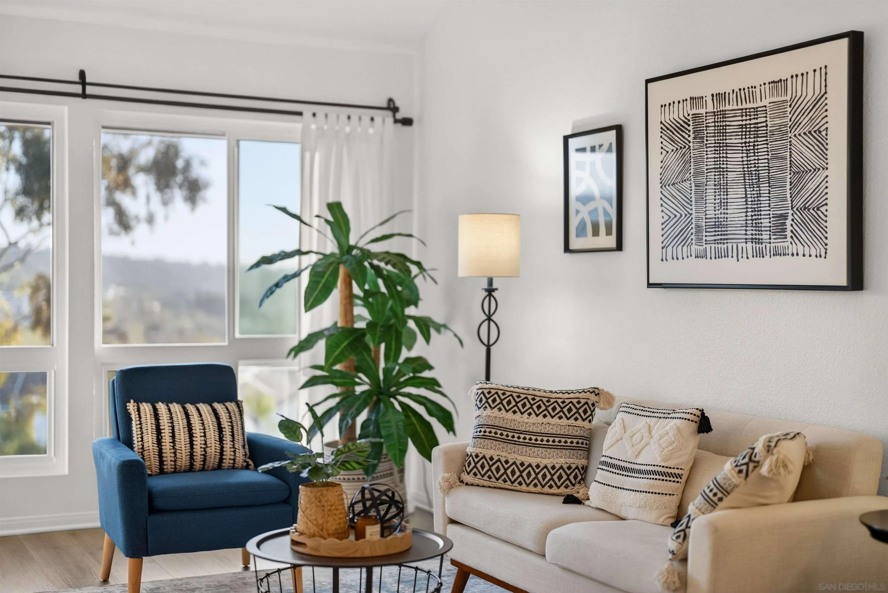 6255 Rancho Mission Road, Unit 302 San Diego, CA 92108 - Photo 3 of 28 a living room with furniture and a large window