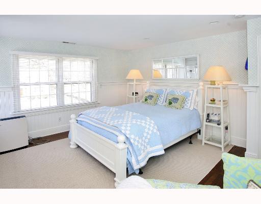 Undisclosed Address Darien, CT 06820 - Photo 7 of 7 a bedroom with a bed and window