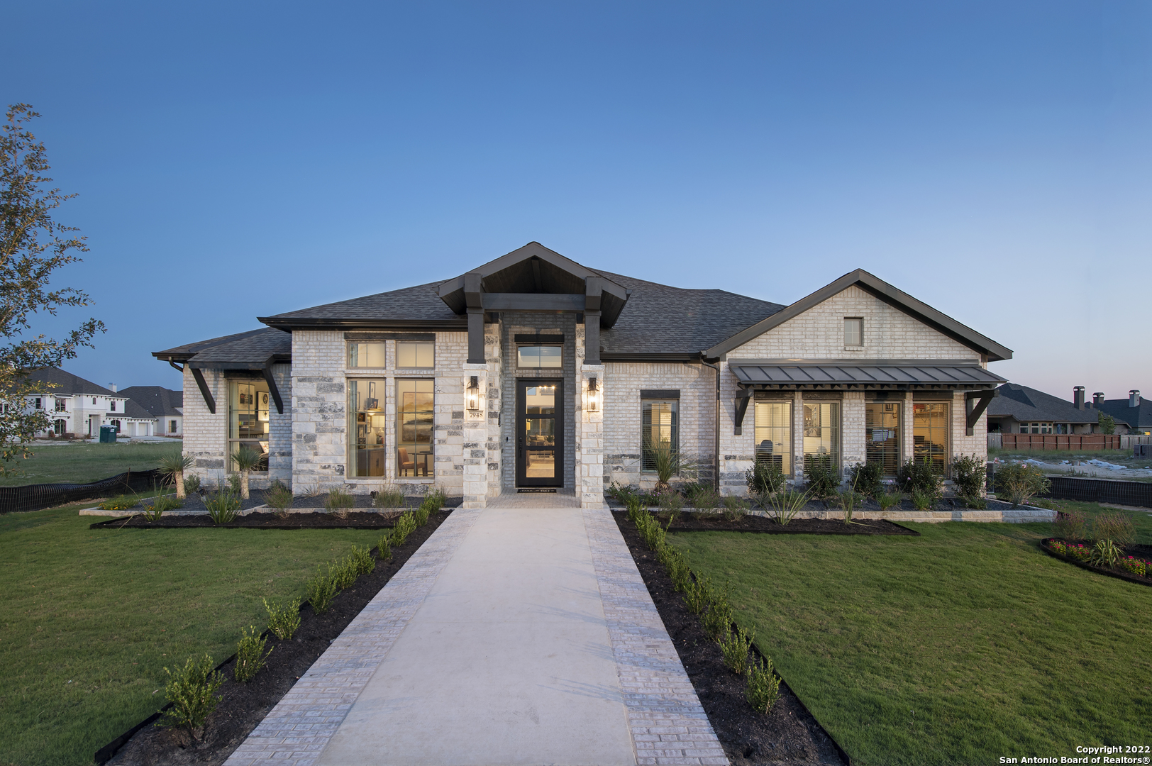 7948 Valley Point Fair Oaks Ranch, TX 78015 - Photo 1 of 1 a front view of a house with a yard table and chairs