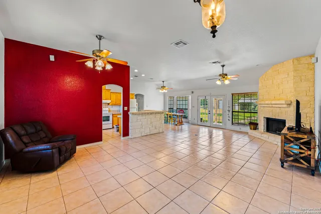 a view of an empty room with a fireplace