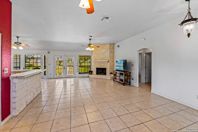 a view of a livingroom with furniture and a chandelier