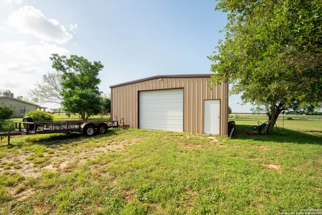 a view of a backyard with parked area