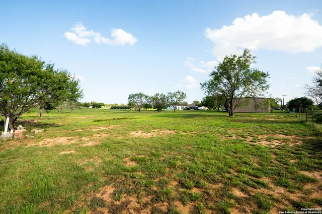a view of a golf course with a lake