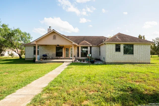 a front view of a house with a garden and porch