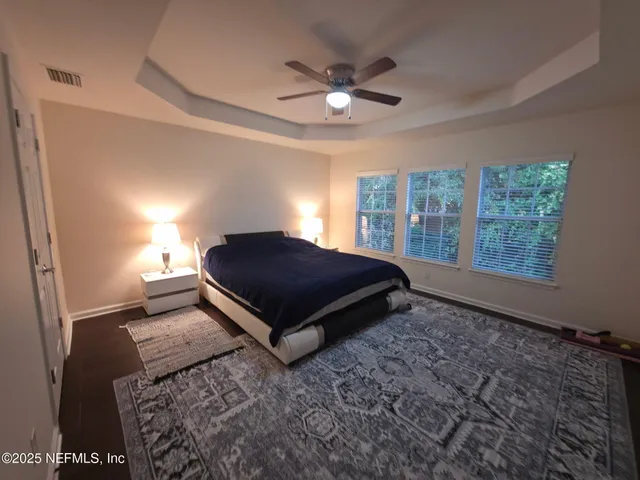 a bedroom with a bed and window