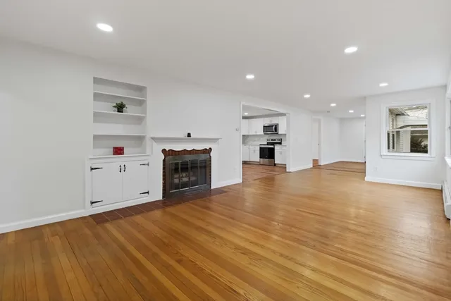 a view of a kitchen with a oven cabinets and wooden floor