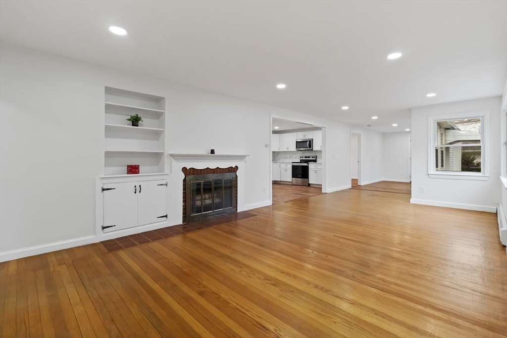 58 Cutler Drive Framingham, MA 01702 - Photo 11 of 36 a view of a kitchen with a oven cabinets and wooden floor