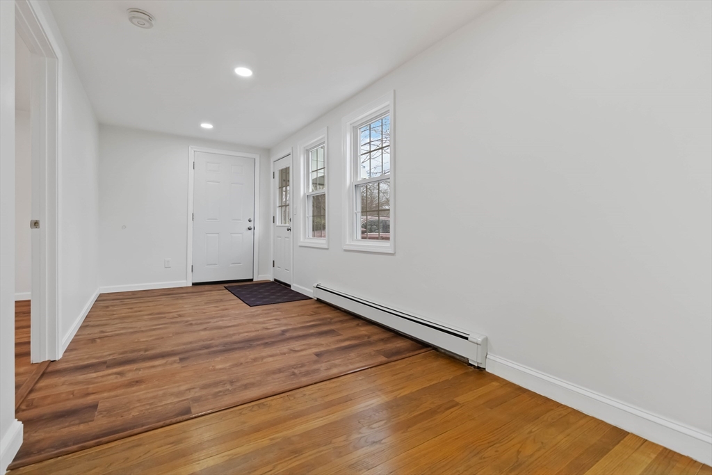 58 Cutler Drive Framingham, MA 01702 - Photo 15 of 36 a view of empty room with wooden floor